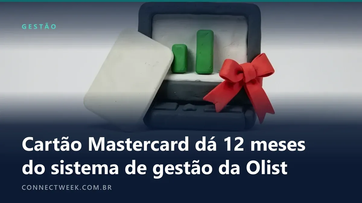Cartão empresarial de massinha ao lado de um computador com laço de presente
