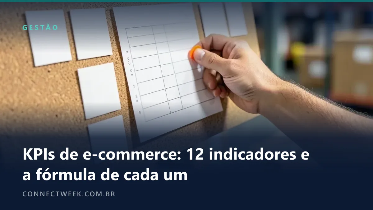 Mão fixando uma folha com tabela em branco num quadro de cortiça acima da bancada, doze fichas em branco em grade ao redor