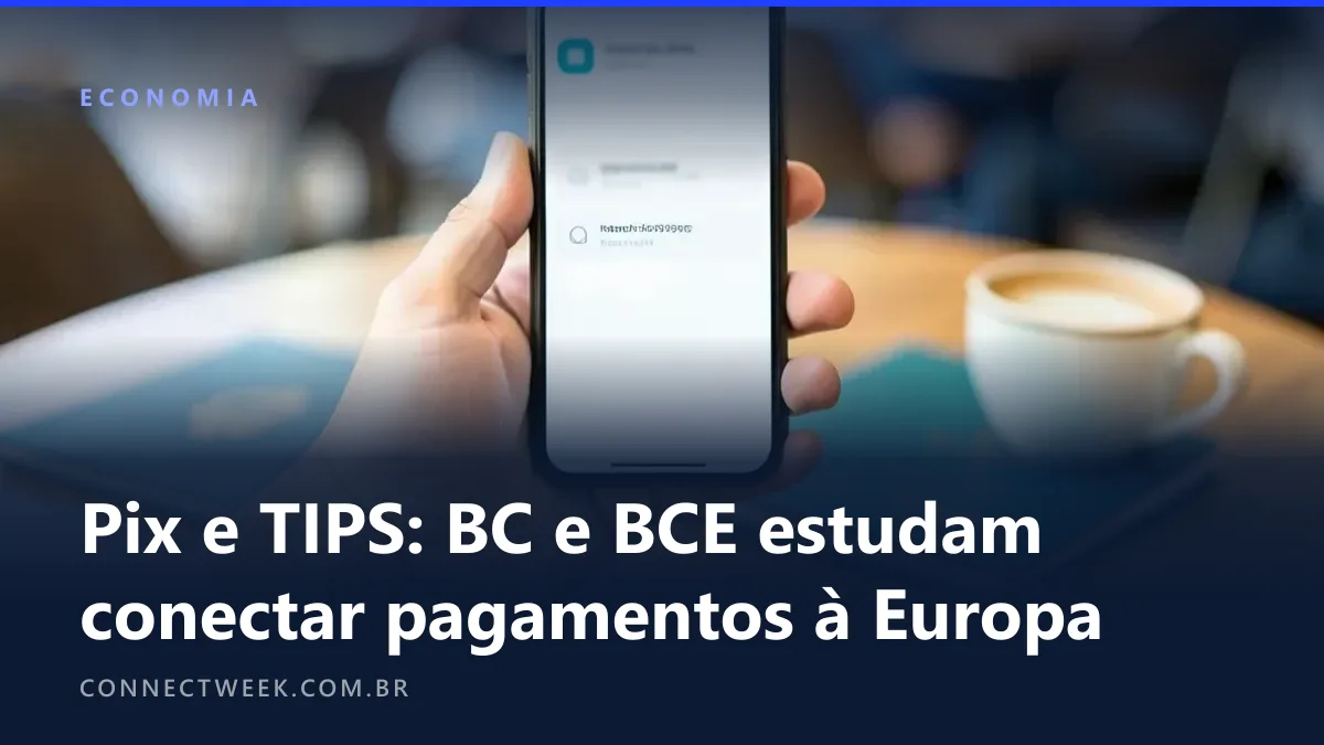 Mão segurando um celular com confirmação de pagamento instantâneo desfocada ao lado de um passaporte e uma xícara numa mesa de café