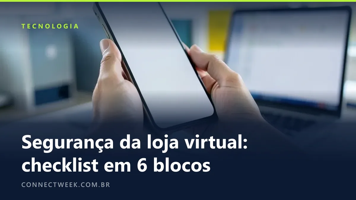 Mão ativando uma verificação em duas etapas desfocada no celular ao lado de um notebook com painel administrativo desfocado